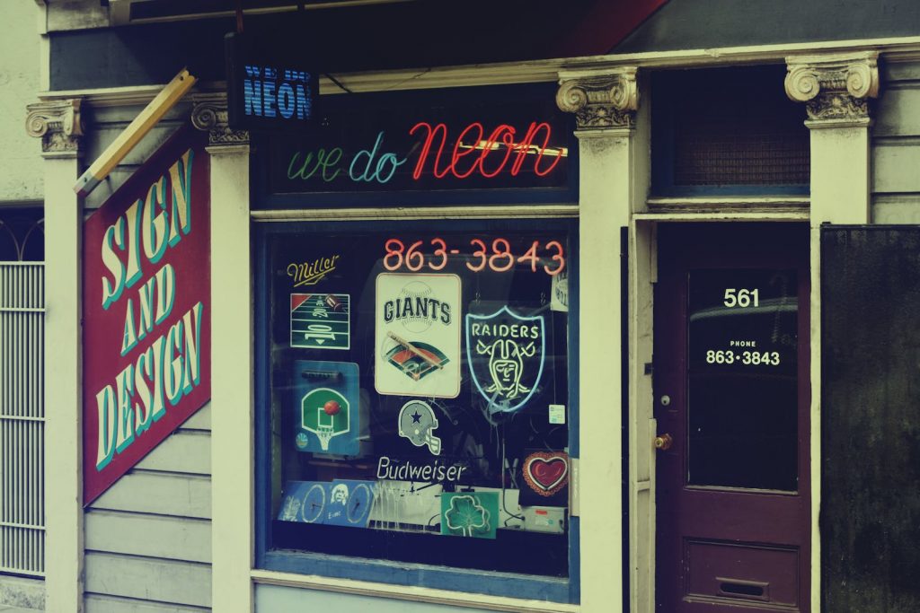 Window of a Store with Neon Signs